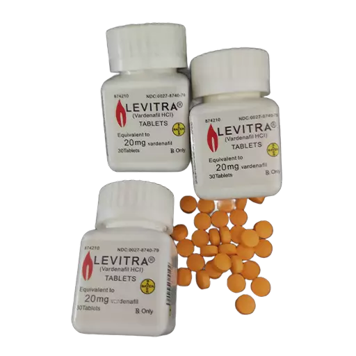 Tri bočice Levitra 20 mg i prosute narandžaste tablete vardenafila